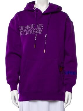 Purple hoodie by KidSuper typical of Colm Dillane’s artistic streetwear brand L